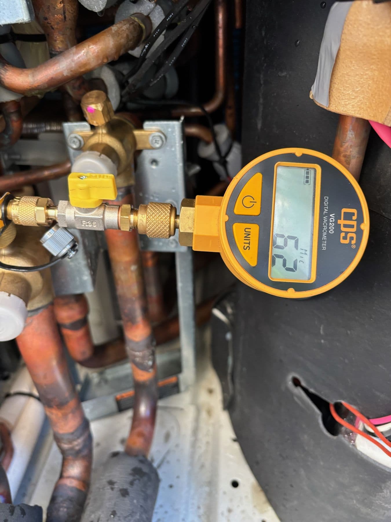 Digital refrigeration diagnostic gauge connected to commercial equipment
